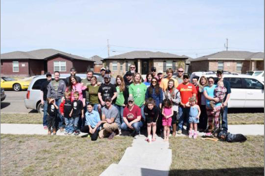Group of over 30 volunteers gathered outside Navy veteran Christopher Bradley's home in Amarillo